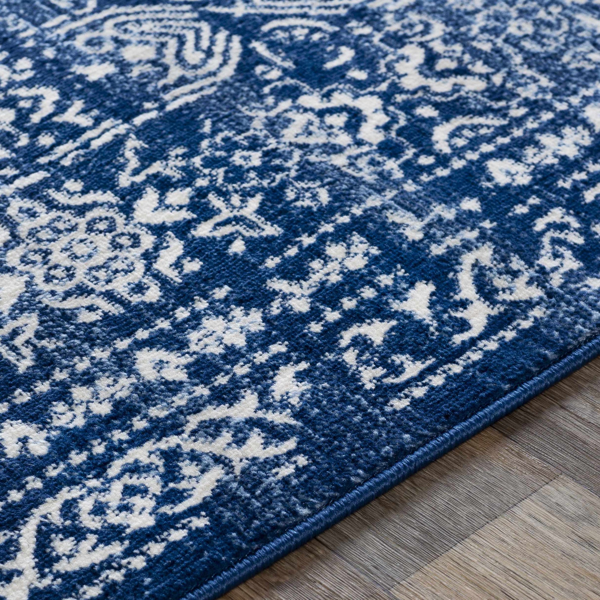 Michie Dark Blue Area Rug - Clearance