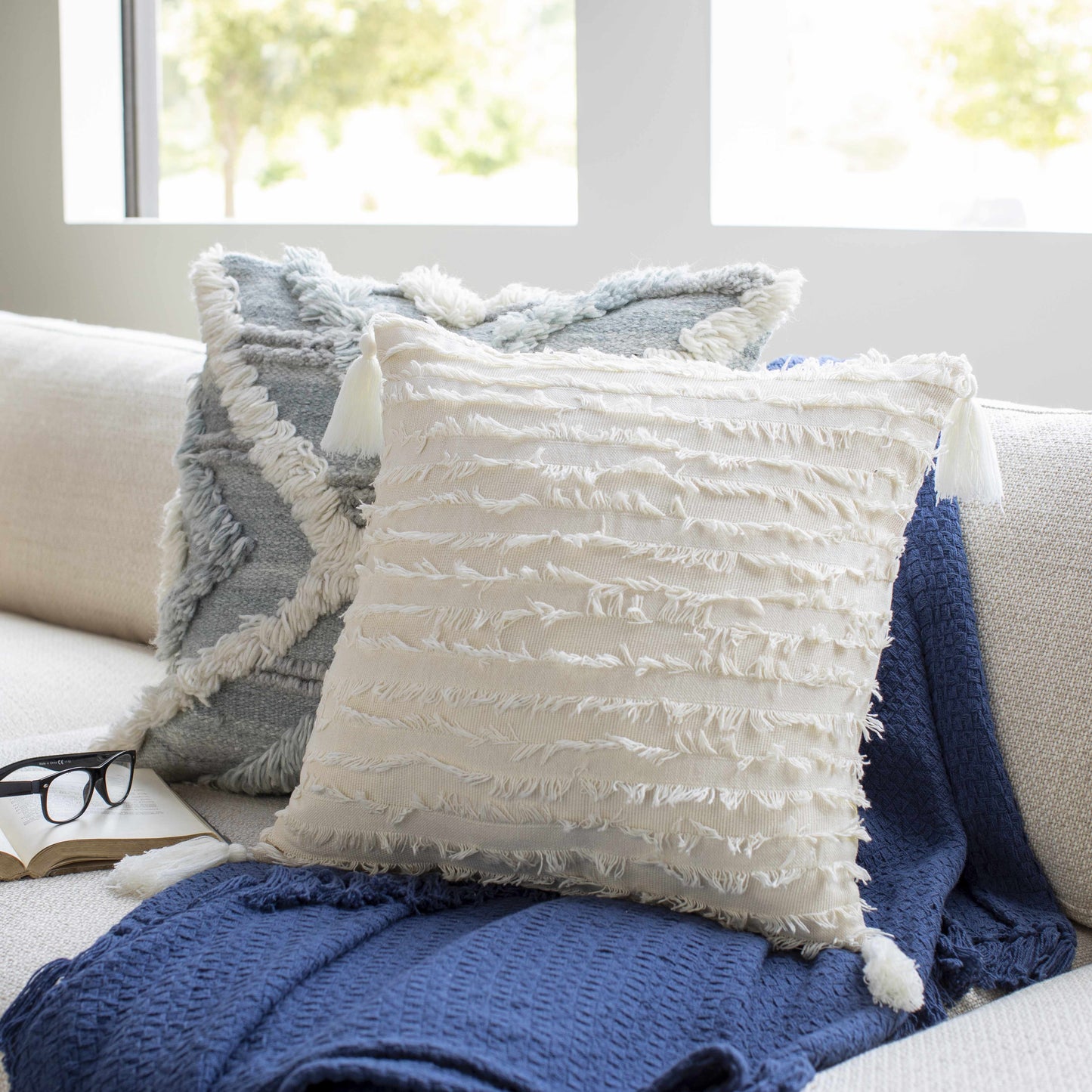 Odon Textured Ivory Tassel Square Pillow